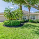 Florida home with lush landscaping. No signs of lawn pests.