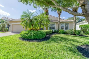 Florida home with lush landscaping. No signs of lawn pests.