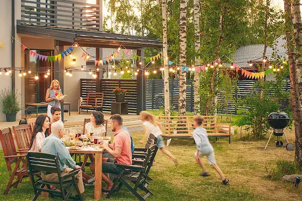 Outdoor party guests around table