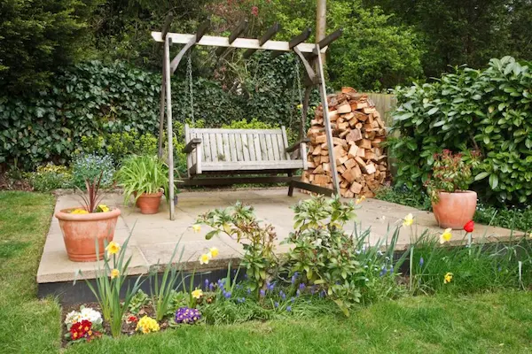 Bench swing on backyard platform